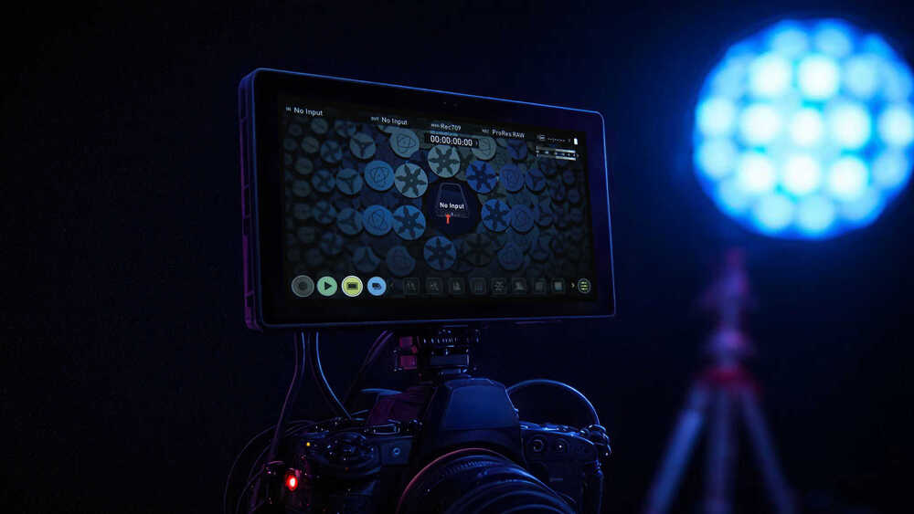 a sony camera with an LED monitor and a light in the background