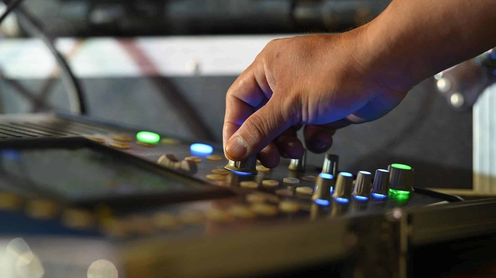 working with sound mixing board