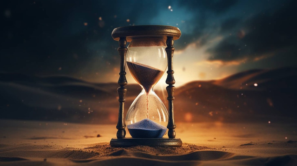 an hourglass with sand falling through